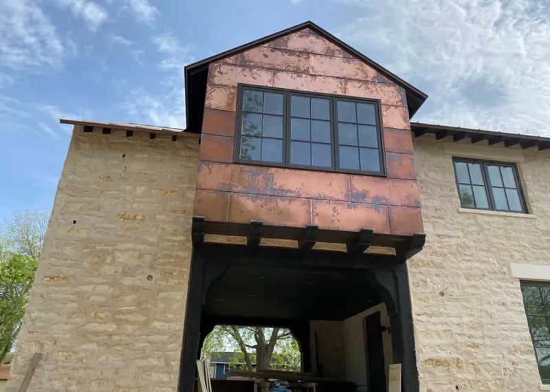 Copper metal panel facade on a stone building for Skylight Installation in Pawling